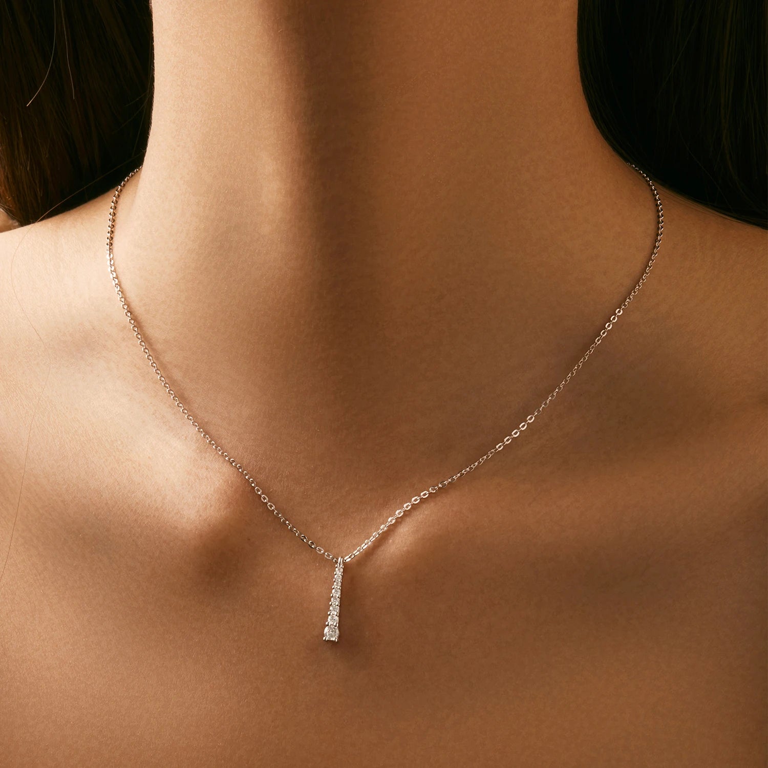 Sterling silver necklace showing a delicate moissanite chain look