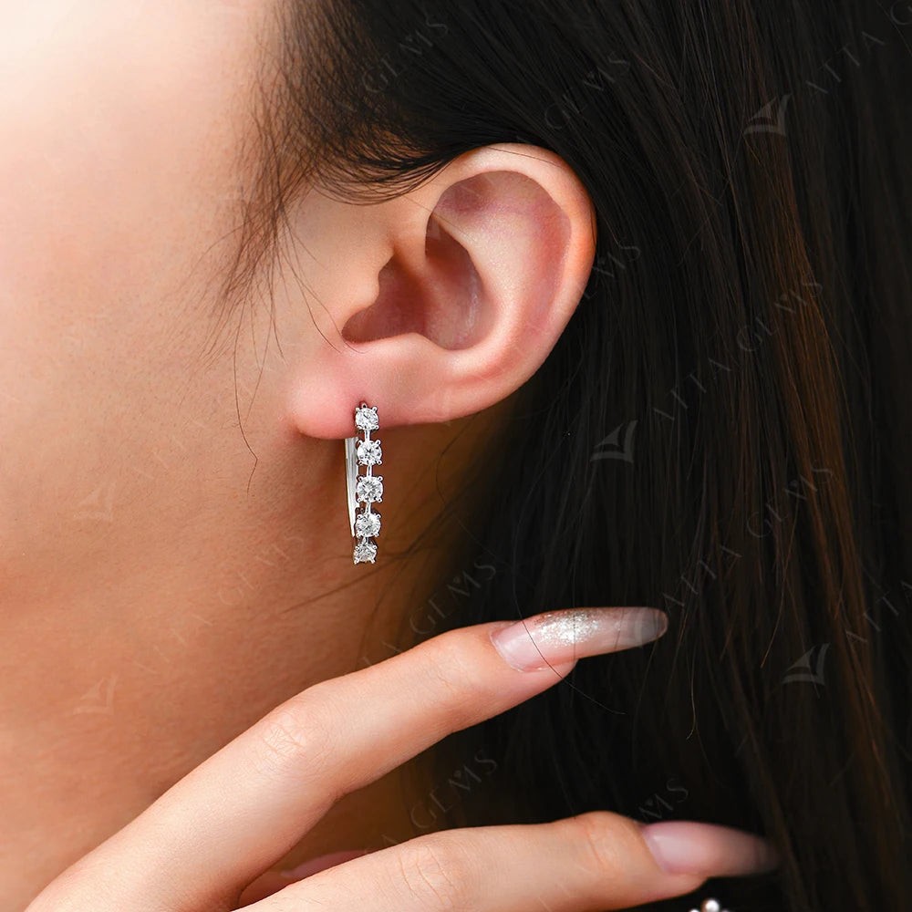 A gold earrings accent paired with moissanite jewelry sparkle