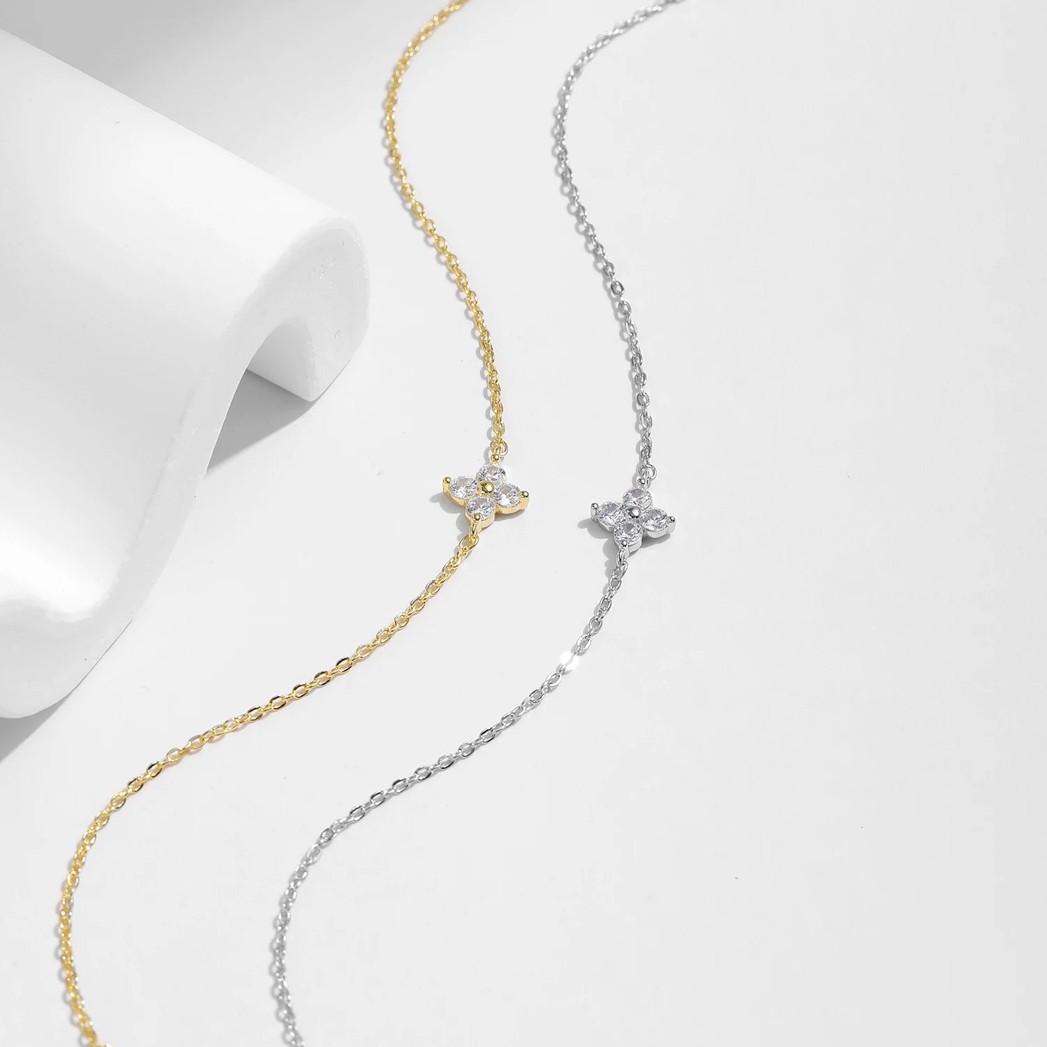 Minimal bracelet charm with white gold finish for refined clover jewellery looks