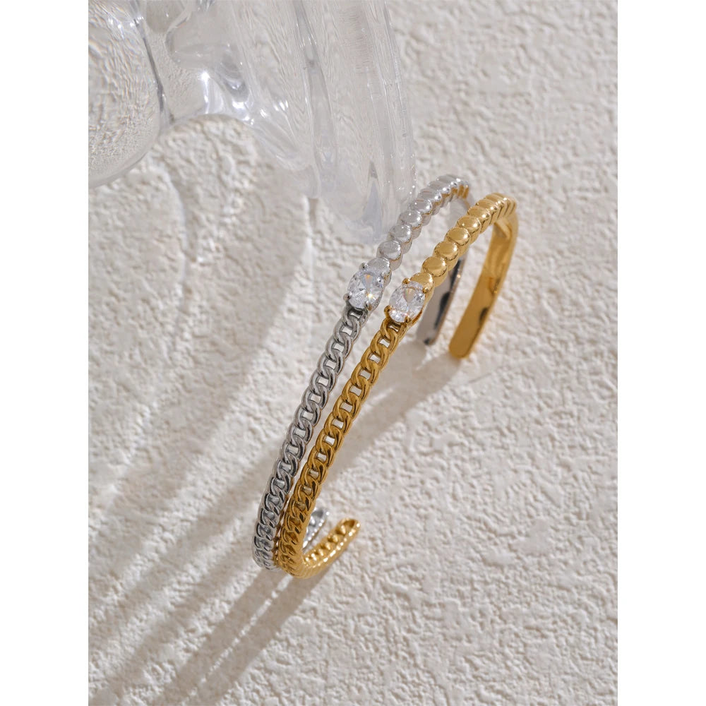 Gold cuff bracelet aesthetic paired with zircon on a sleek bracelet chain