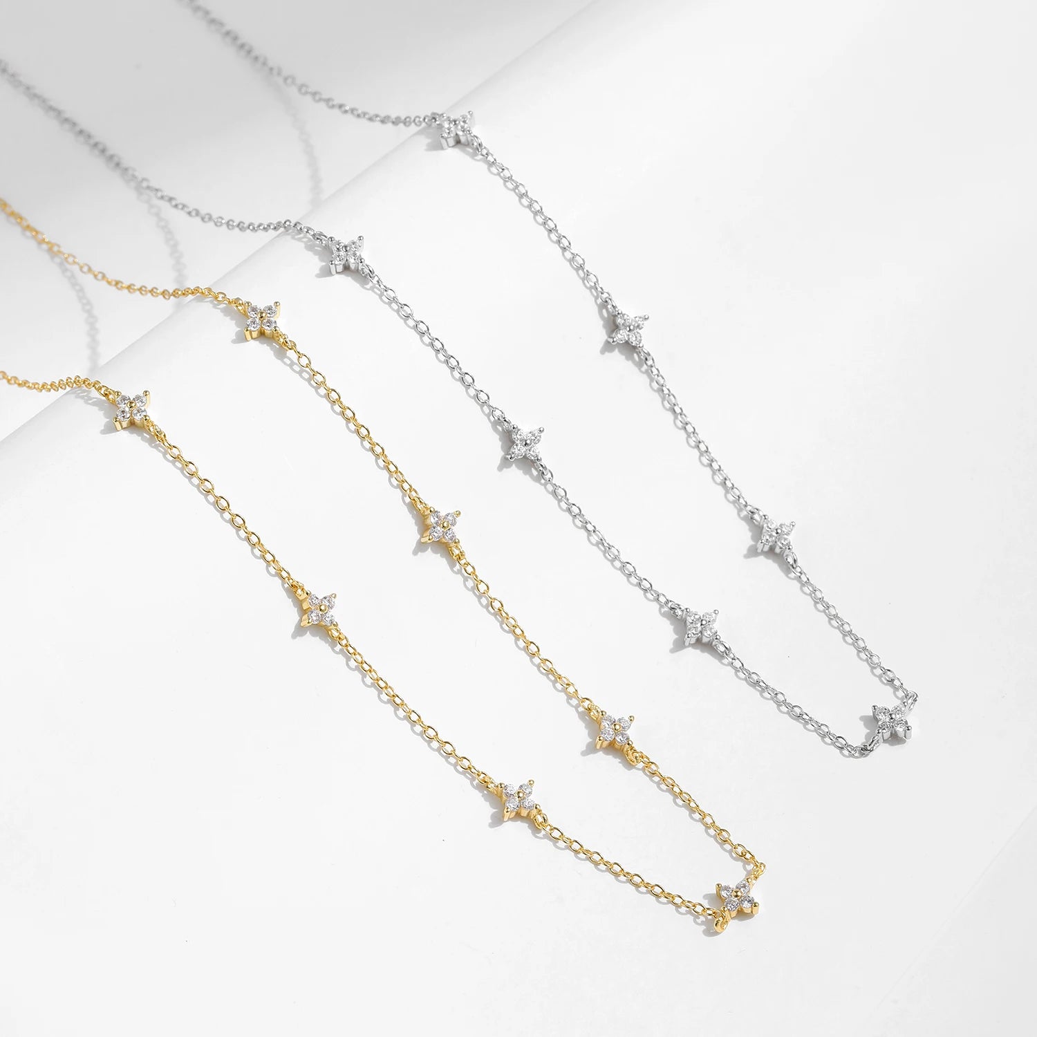 Silver necklace styled as a refined clover jewelry piece