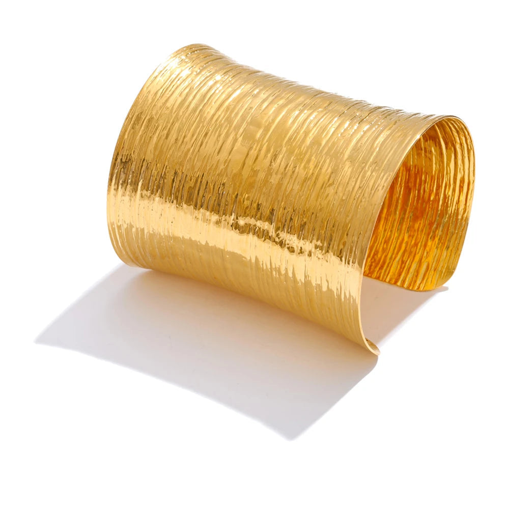 Wide cuff bracelet with gold plated glow as a gold bracelet bangle