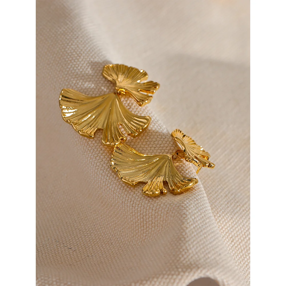 Gold a earrings featuring ginkgo leaf motif drop design