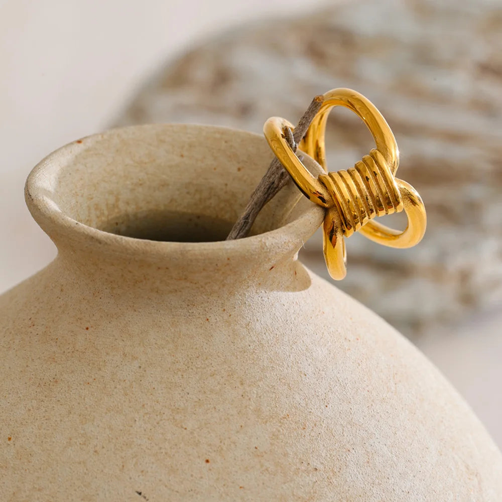 Stainless steel rings with polished knot shape