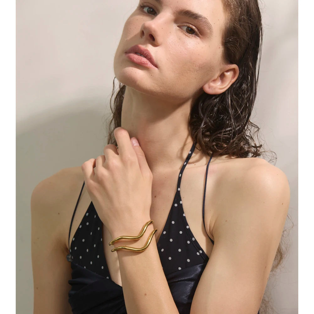 Stainless steel jewelry finish on a gold plated bangle bracelet bangle