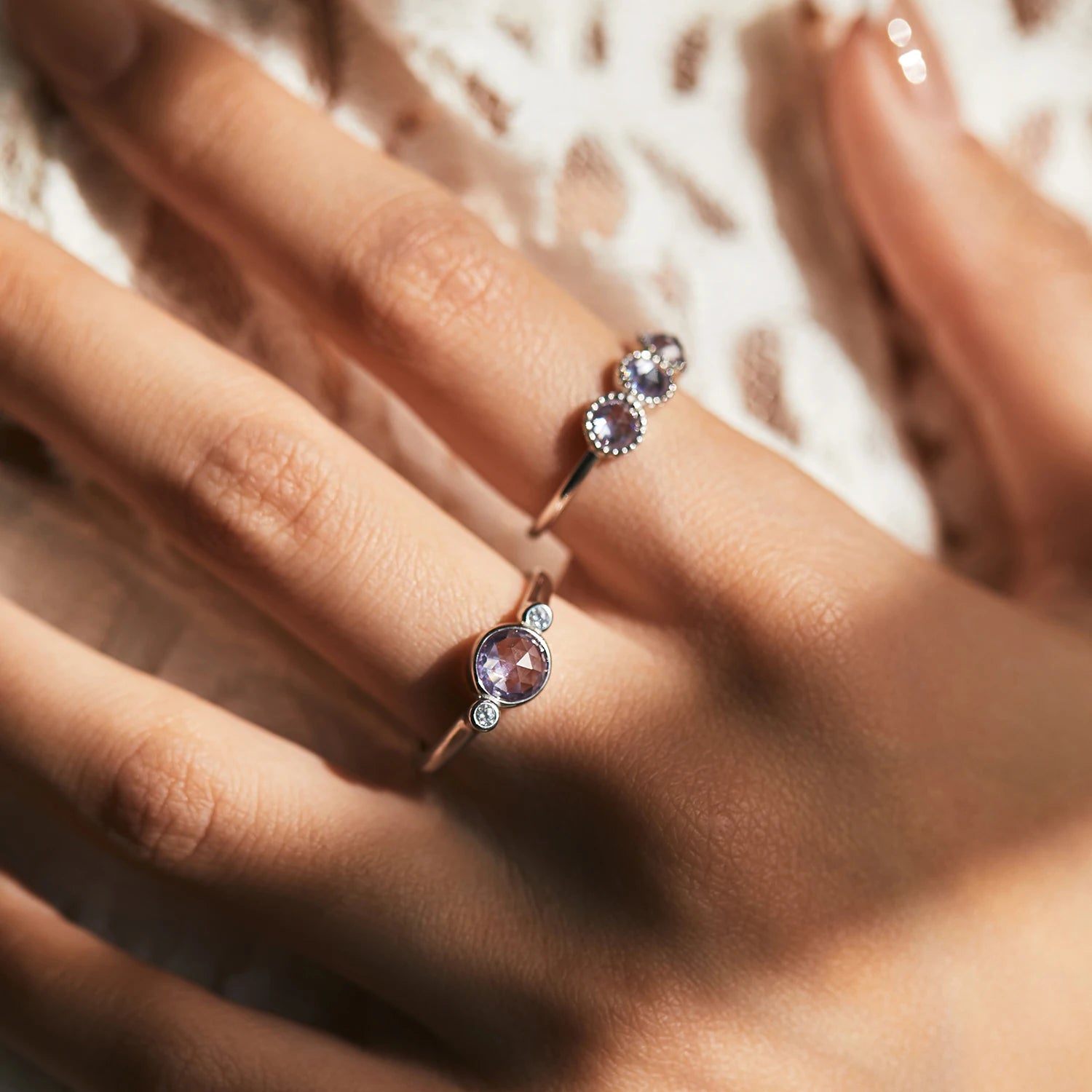 Silver ring featuring a gem purple center and ring with size comfort