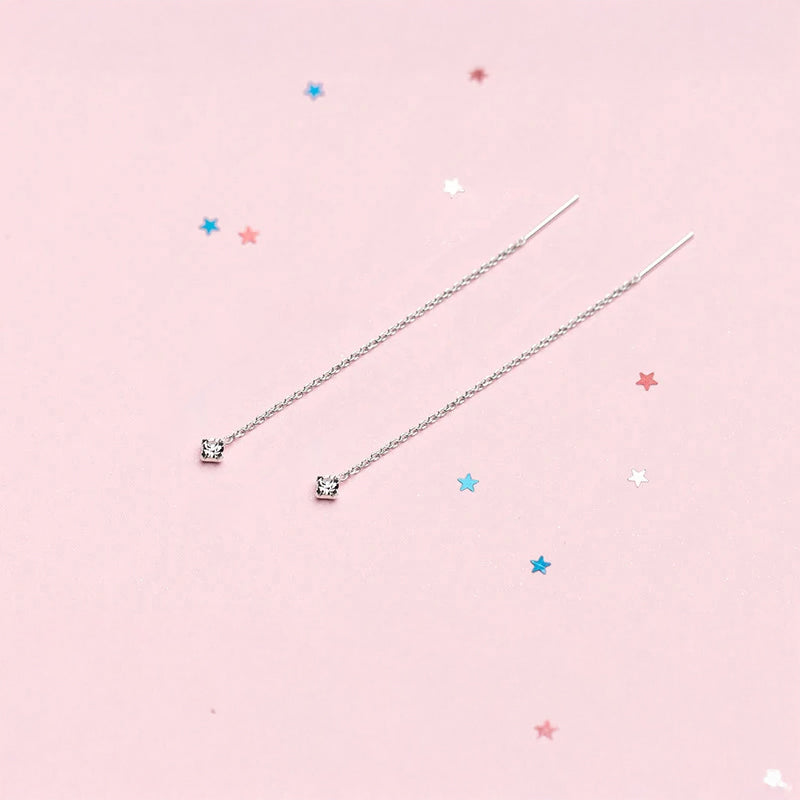 Evening ready dangle earrings with blue stone sparkle and crystal jewelry finish