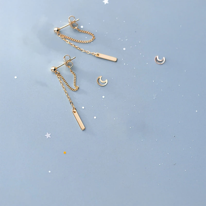 Product shot of earring earrings with linked chain and mixed metal finish