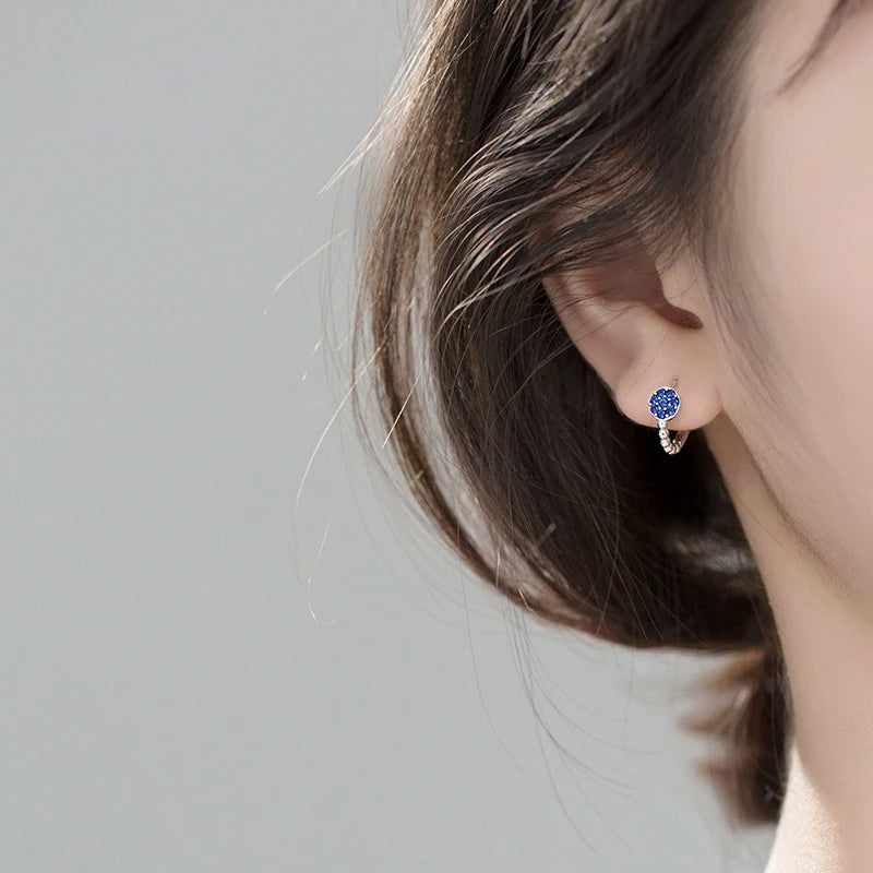 Elegant ear rings with a mix of sterling silver and blue crystal sparkle