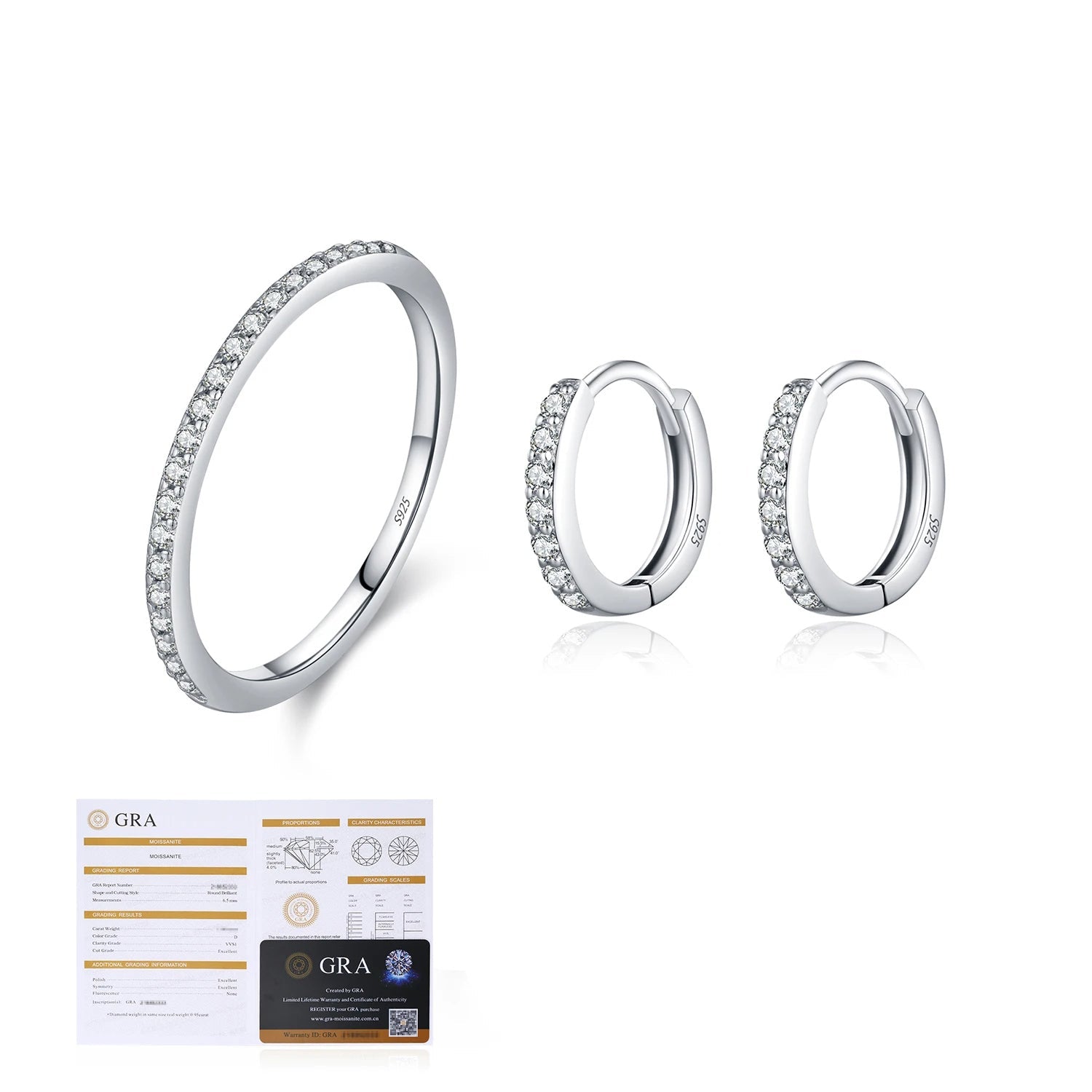 Elegant moissanite earrings and ring arranged on white background