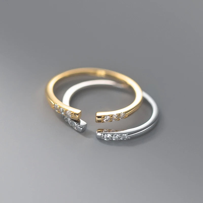 Close view of sterling silver ring with gold and ring harmony