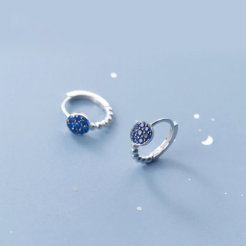 Hoop earrings design with blue crystal and delicate bead detail