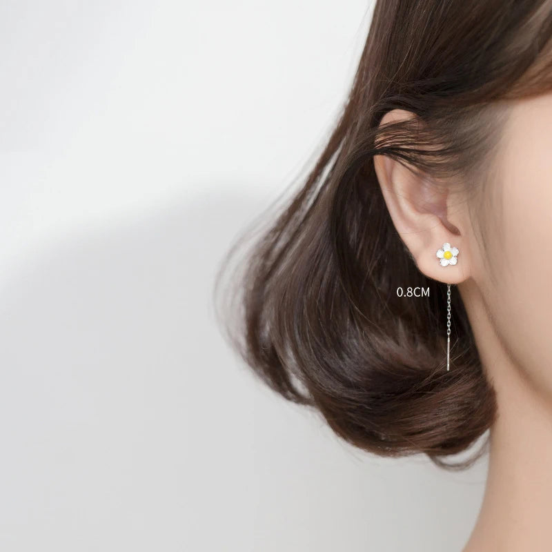 Minimal shot of cute earrings styled as delicate flower earrings