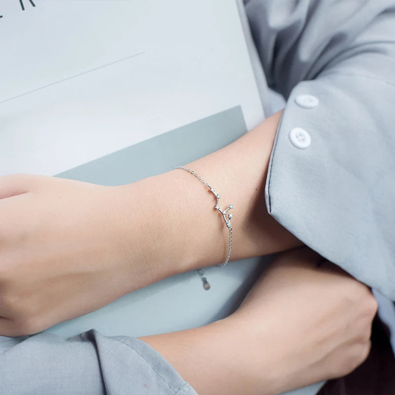 Bracelet charm bracelet styled as a silver bangle in soft silver color