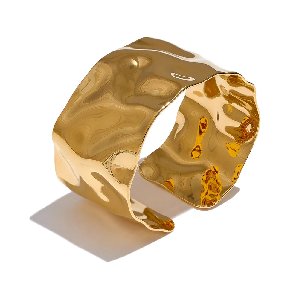 Gold cuff bangle statement with shiny metal gleam