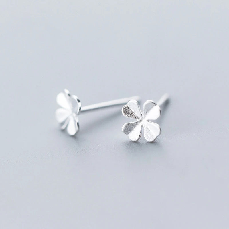 Stud earrings showing refined clover jewelry style