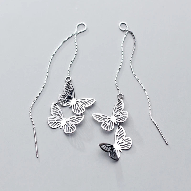 Silver color butterfly earrings styled for jewelry sets