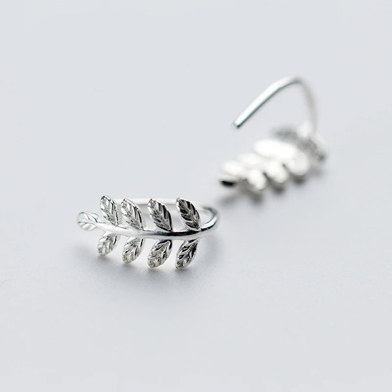 Sterling silver earrings in hoop style with moving leaf charm