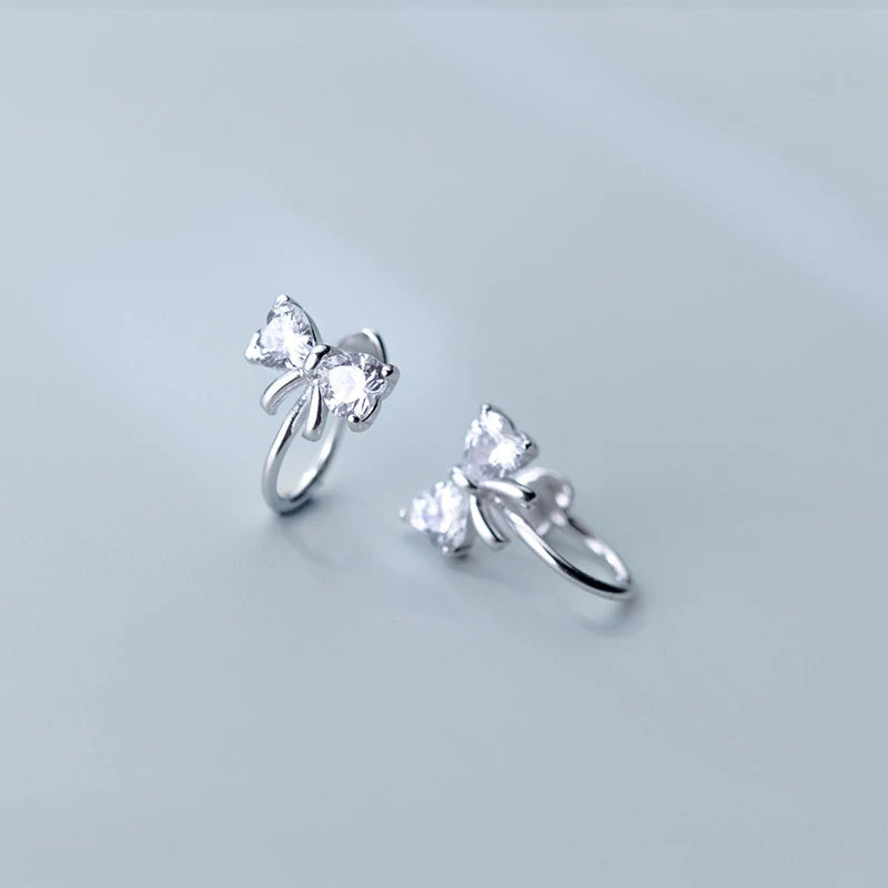 Silver color finish on cz bow earrings for polished shine
