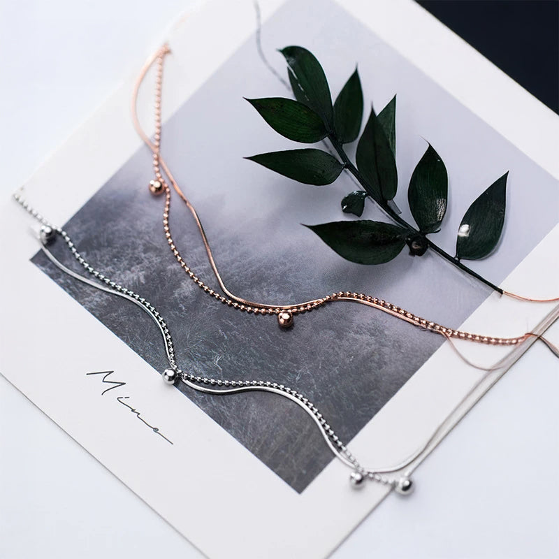 Layered chain bracelet styled as a sterling silver bracelet