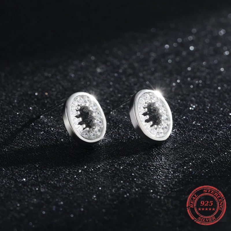Pair of oval stud earrings with clear CZ stones for elegant daily wear