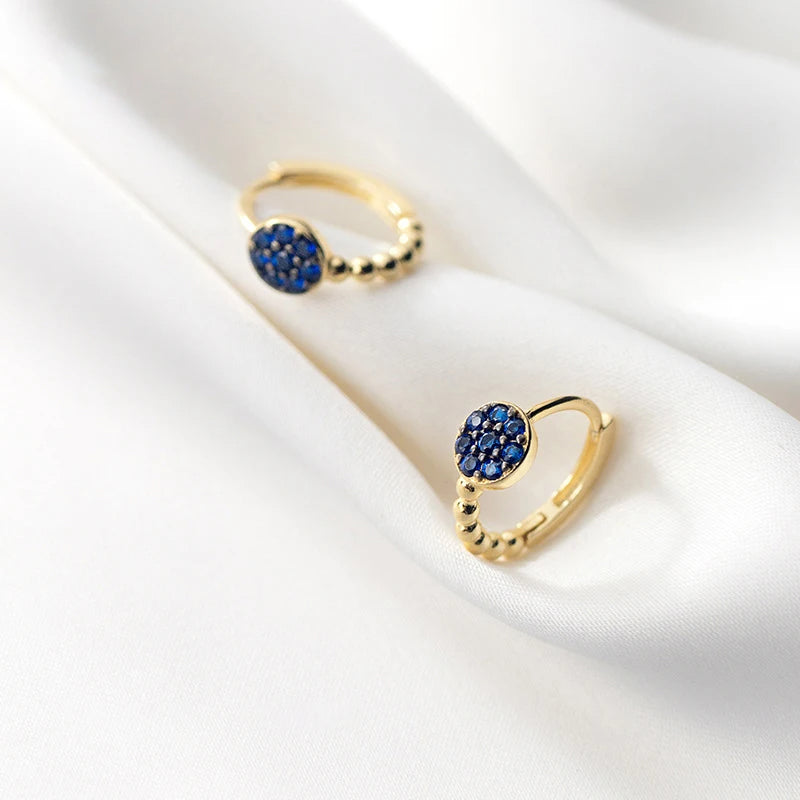 925 sterling silver hoop earrings accented by stacked blue crystal beads