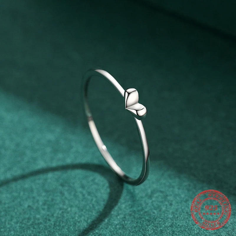 Close up 925 sterling silver band with subtle heart rings accent