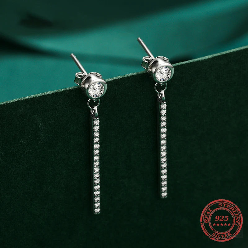 Sterling silver drop earrings with a smooth cz finish