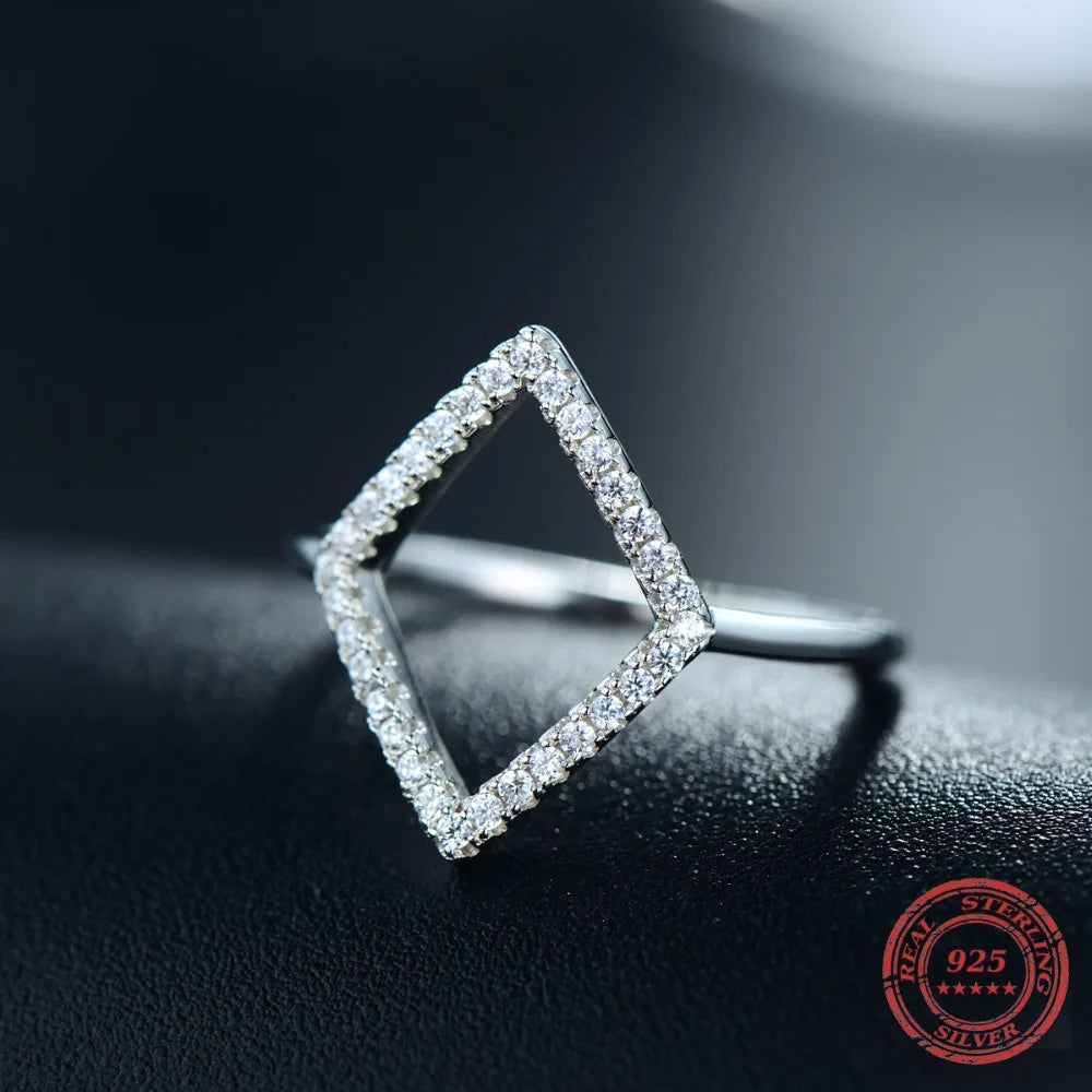 Ring with cubic zirconia stones in geometric pattern