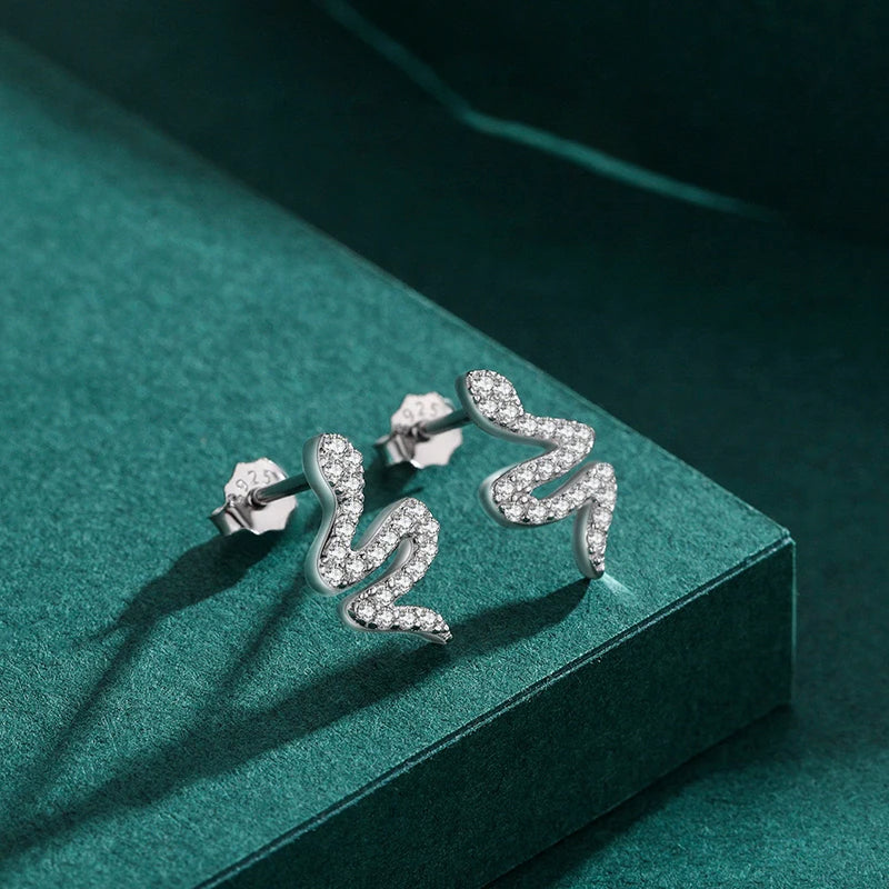 Silver earrings featuring snake cz and bright cubic zirconia