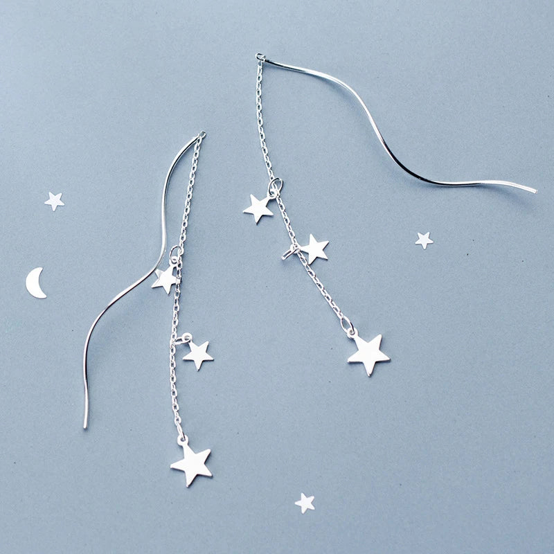 Light and airy ear rings styled as star earrings for evening looks