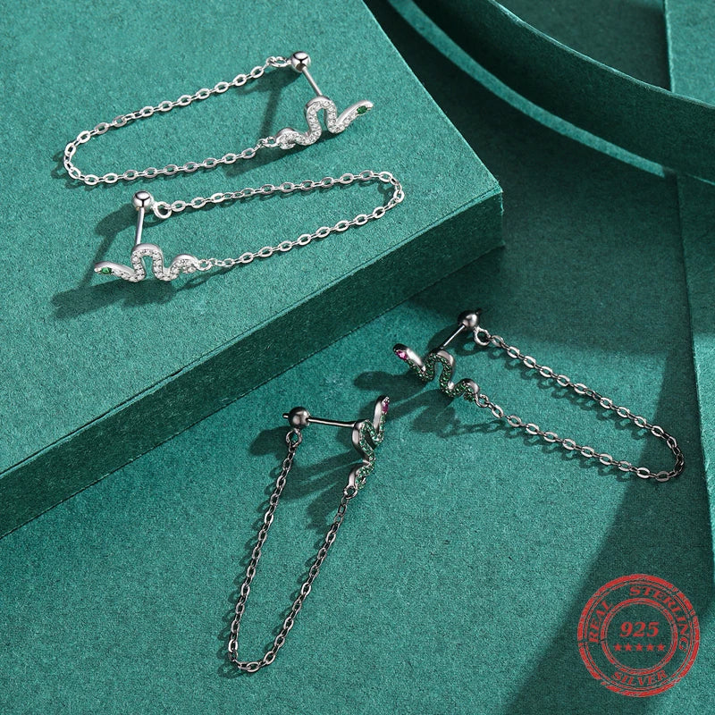 Statement earrings in silver color with sleek snake earrings design