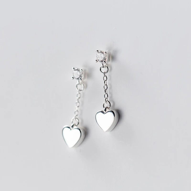 Silver earrings for women featuring heart earrings in a delicate drop earrings look