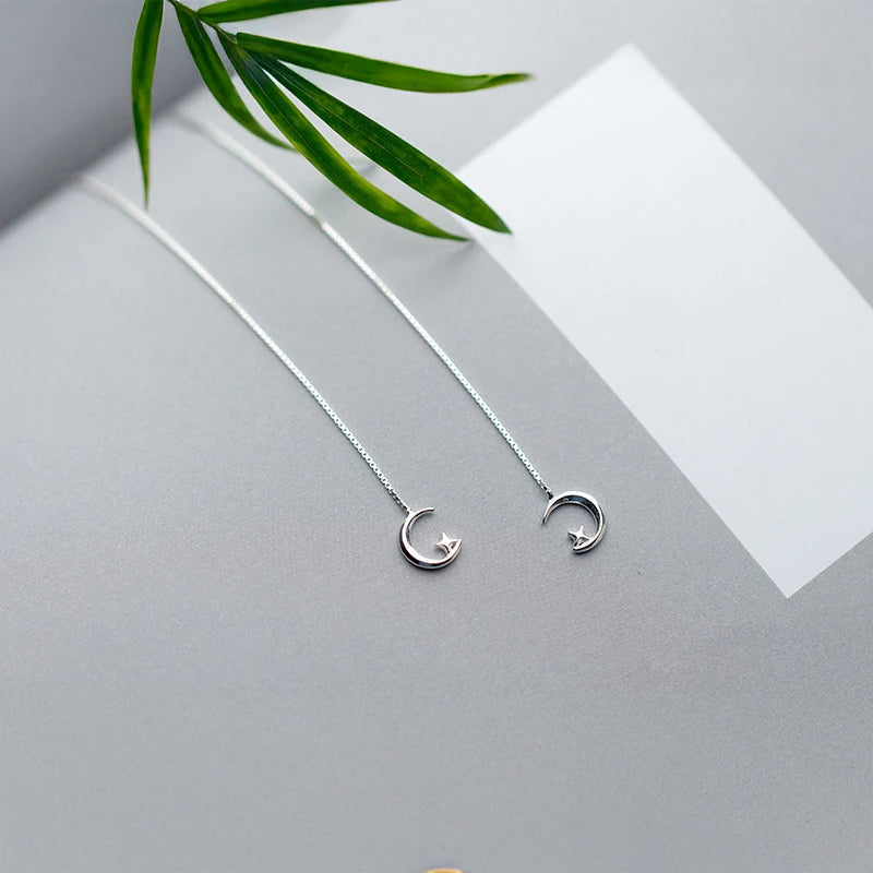 Silver color ear rings featuring dream moon and chain long movement