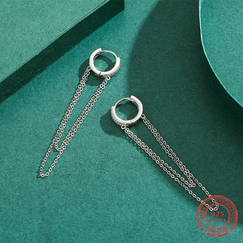 Delicate tassel detail on sterling silver hoop earrings