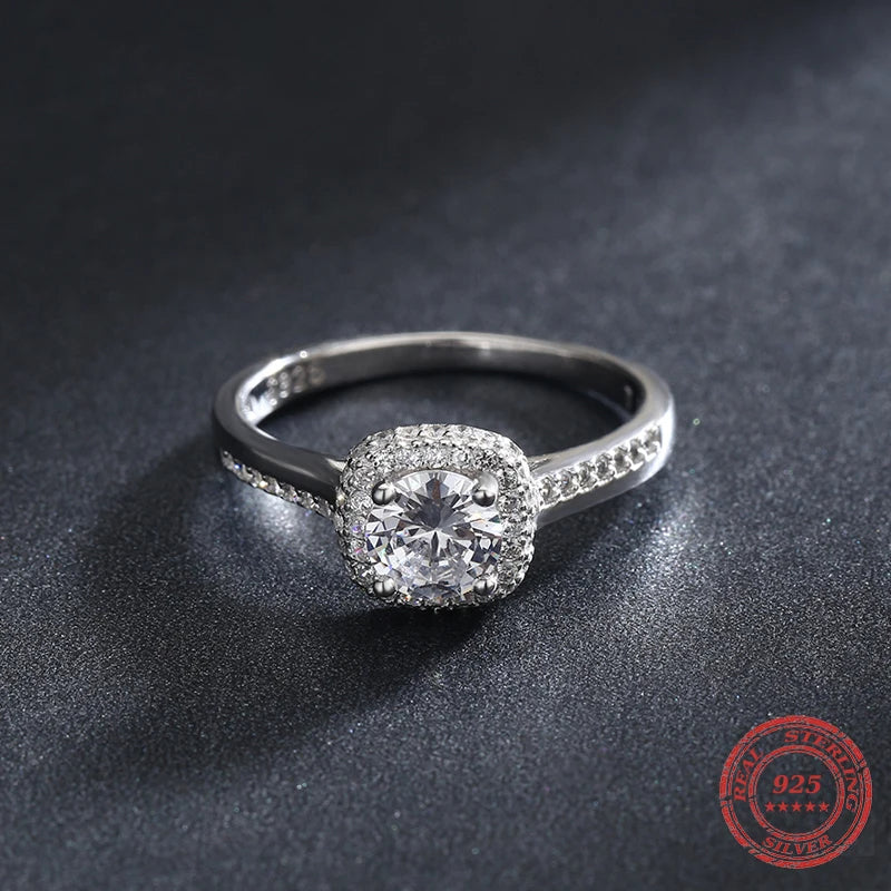 Elegant round engagement ring styled as a wedding ring in silver