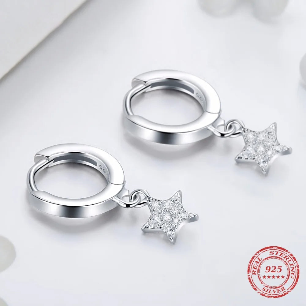 Dangle earrings gold next to earrings gold earrings for contrast