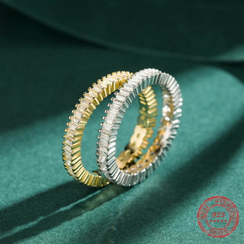 Silver ring designed as a wedding ring ring with cz rings detail