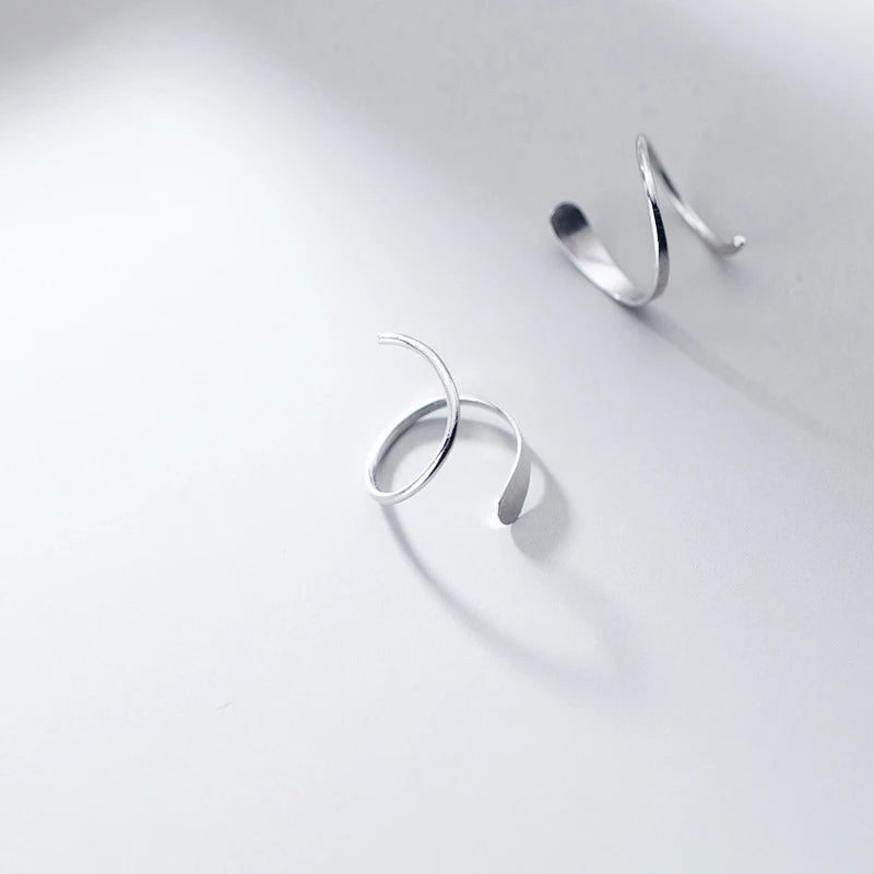 Earrings stud earrings set featuring geometric wave details