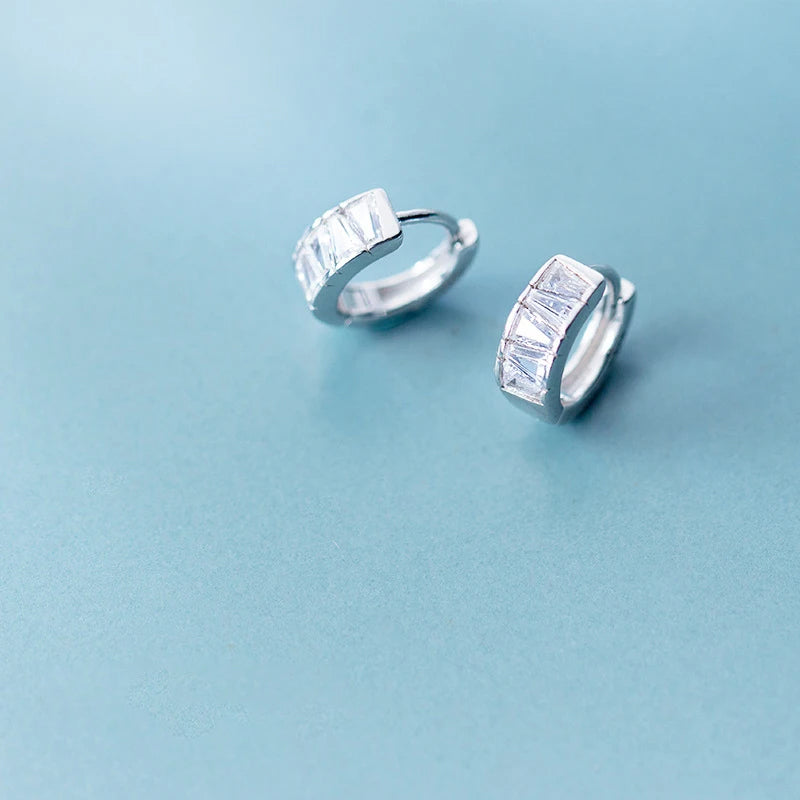 Elegant ear rings in silver color styled as cz earrings