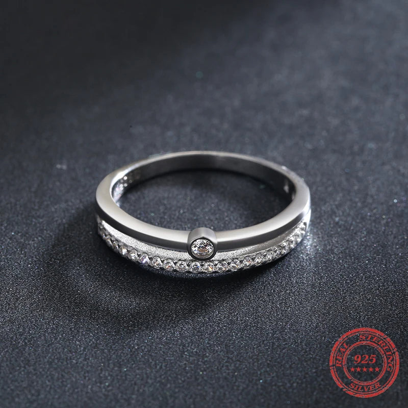 A wedding ring presented with gentle cz rings sparkle and smooth fit