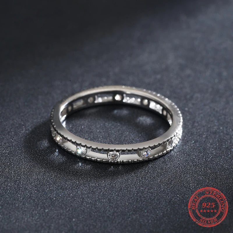 Minimal sterling ring layered beside another 925 sterling silver band