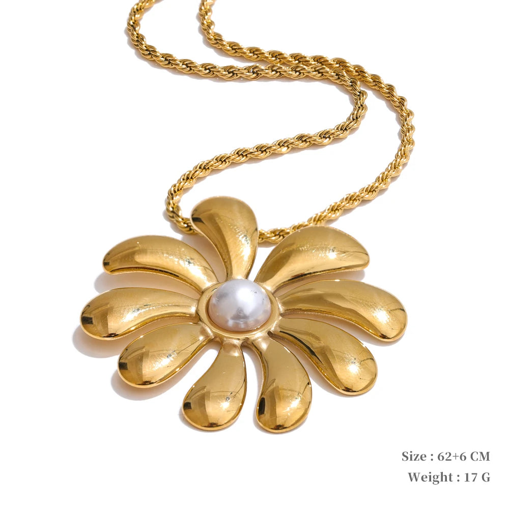 Flower necklace pendant on a fine gold chain with necklace and necklace layering