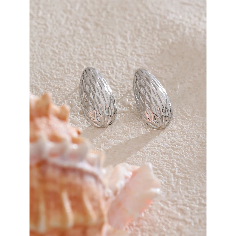 Women with earrings wearing modern gold plated stud design