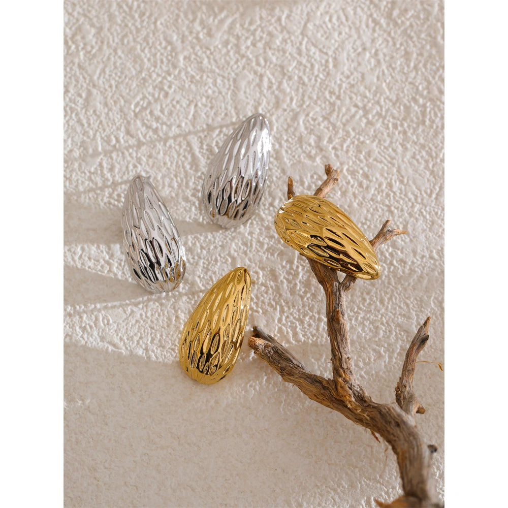 Elegant stud earrings showing striped stainless steel jewelry detail