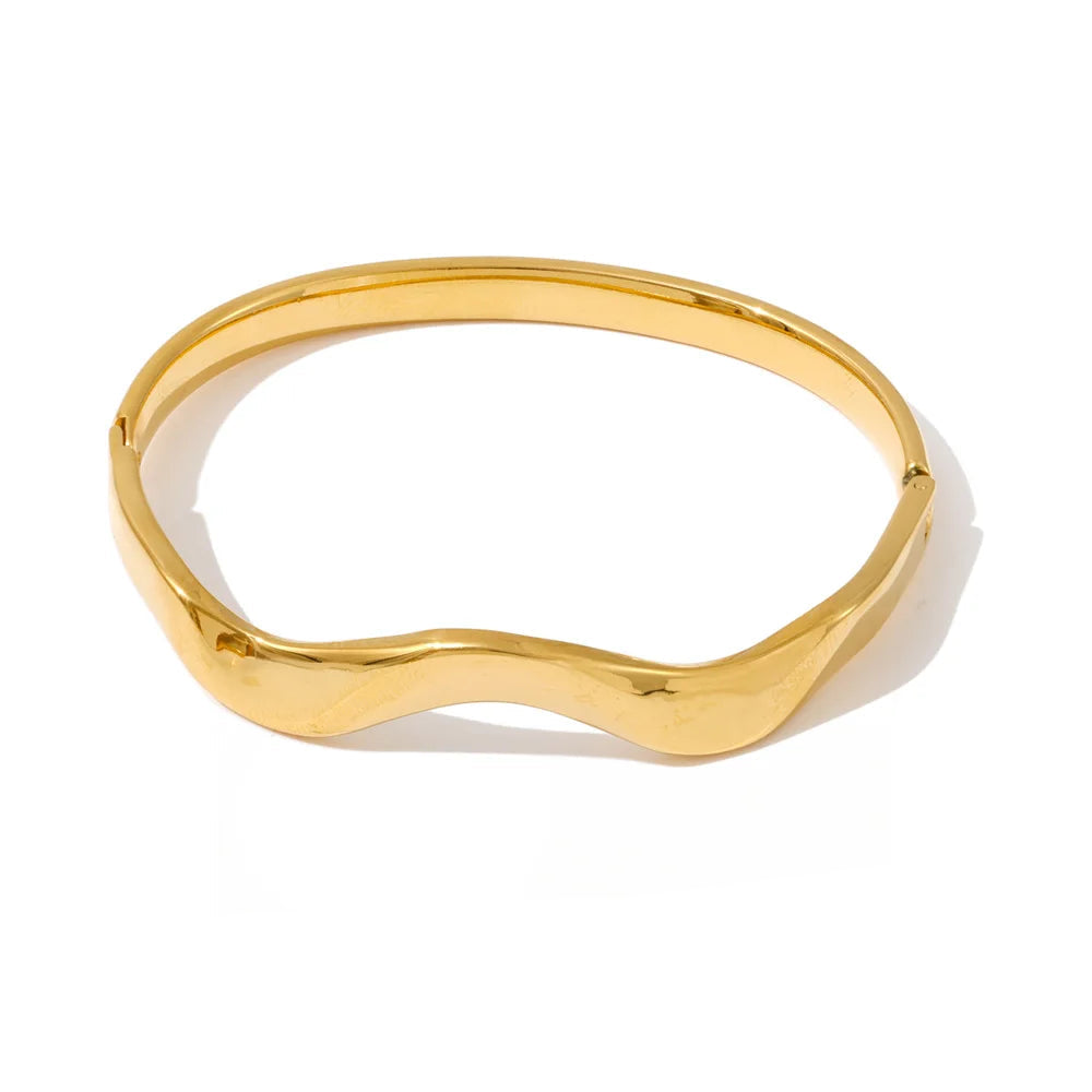 Minimalist gold bangle bracelet with smooth geometric shape