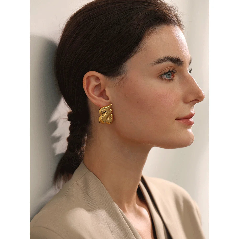 Stud earrings gold shown with a refined gold earrings finish