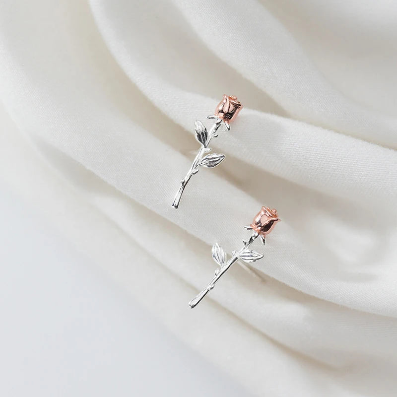 Ear rings arranged as women stud earrings with gold rose detail