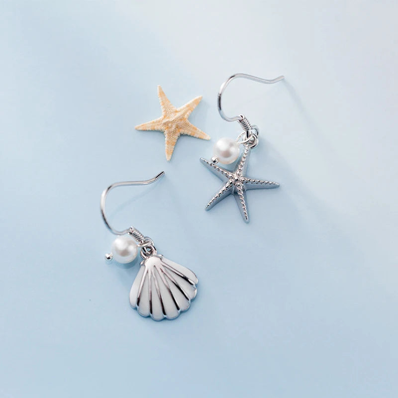 Sterling silver dangle earrings with starfish jewelry motif and shell detail