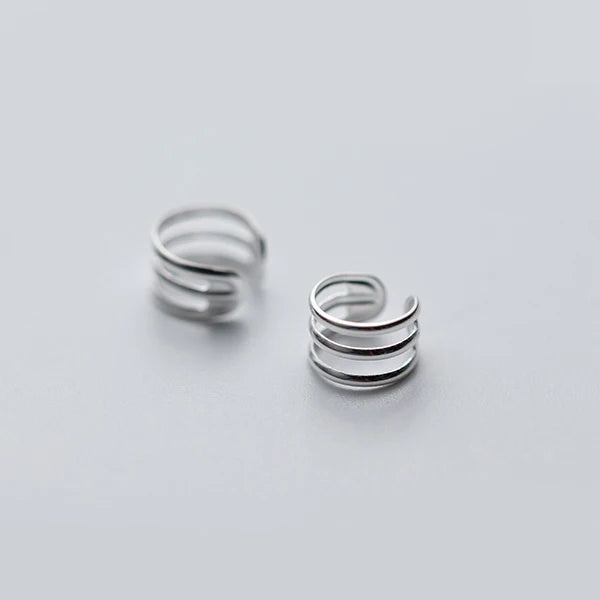 Clip earrings with hollow detail and charm earrings accent for polished style